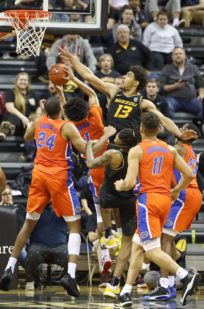 Mark Smith attempts to block a shot from Florida